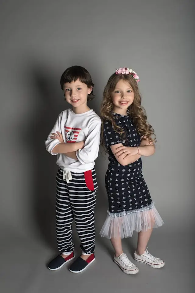 A display of colorful clothing for kids on hangers. Shop kids' fashion at The Hanger.